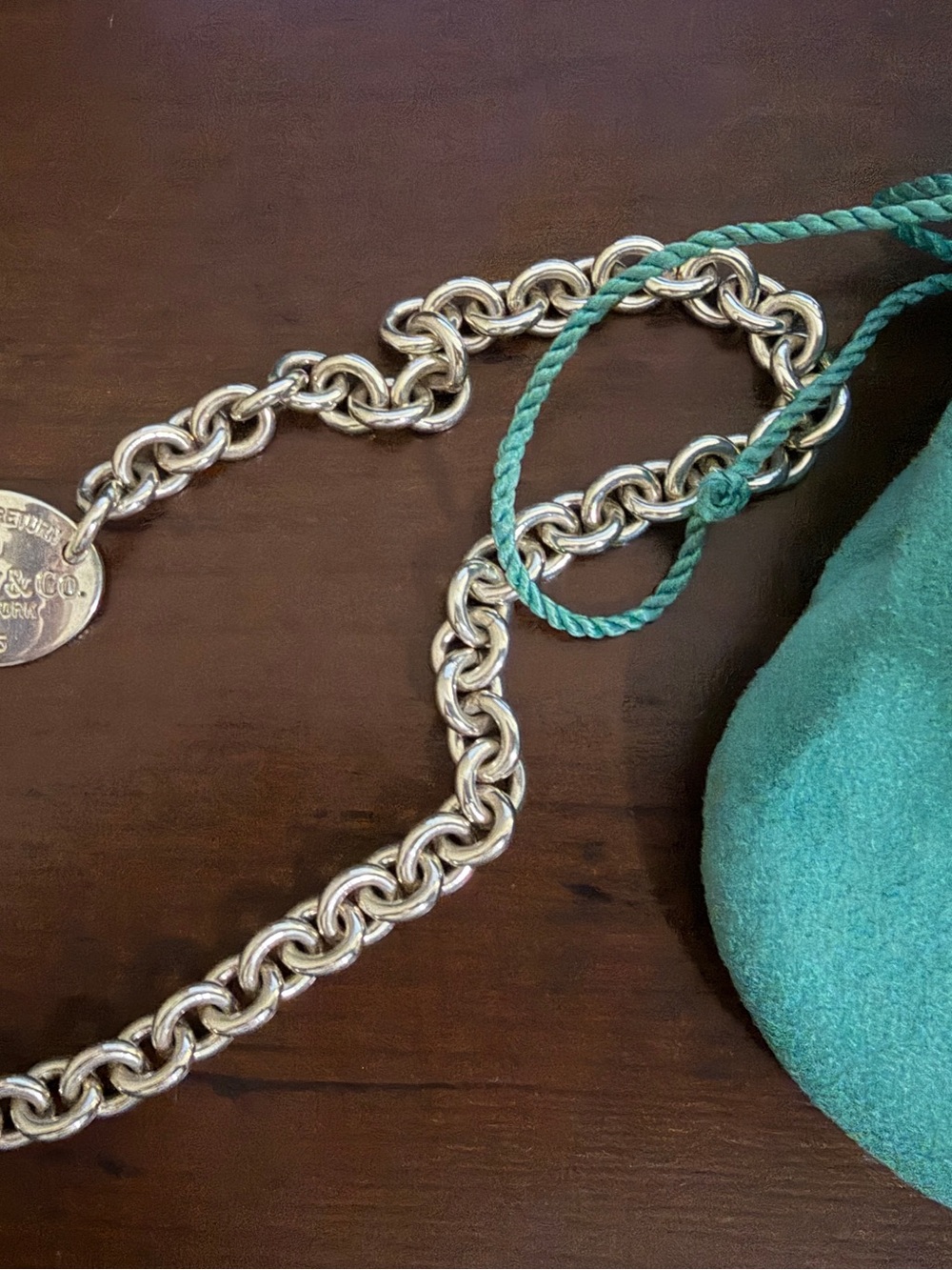 Tiffany & Co. Sterling Silver Round Charm Necklace with Teal Pouch Accent